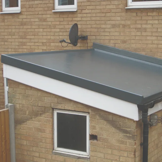 Smooth grey flat roof on a brick extension, with white fascia and black guttering
